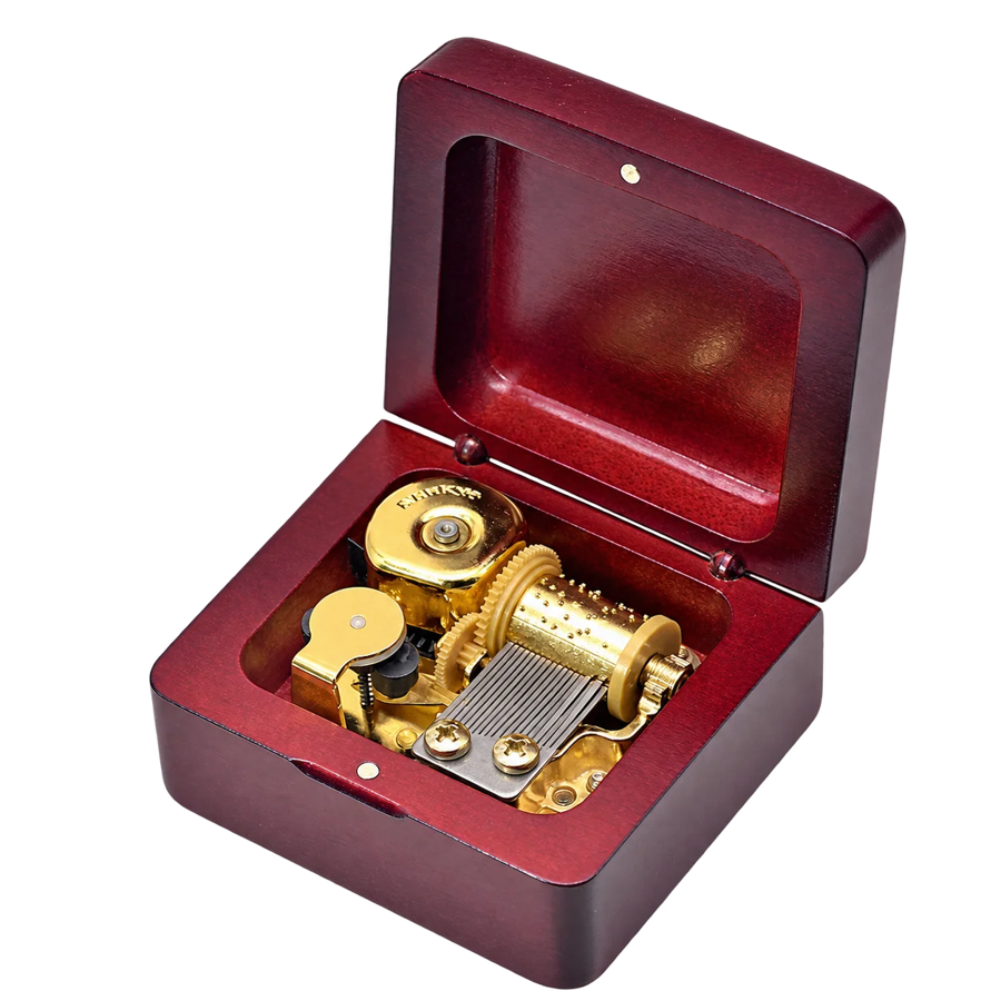 Red wooden square music box with open lid and visible musical movement